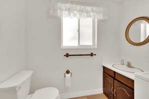 Bathroom featuring toilet and vanity