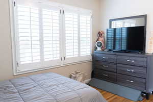 Bedroom featuring wood finished floors