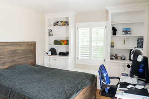 Bedroom featuring multiple windows