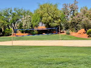 Surrounding community with volleyball court and a lawn