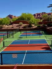 View of tennis court with a mountain view