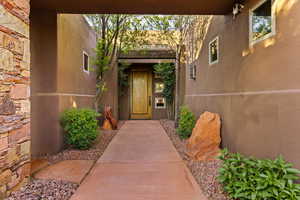 Property entrance with stucco siding