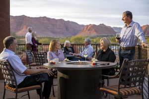 View of patio featuring a mountain view and an outdoor fire pit