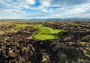 Aerial view of mountains and a local golf course