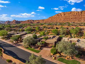 View of mountain backdrop featuring nearby suburban area