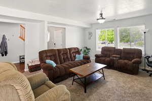 Carpeted living room with baseboards