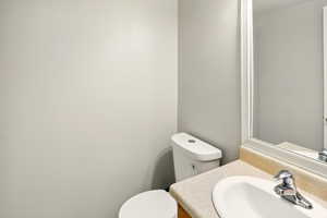 Bathroom with toilet and vanity