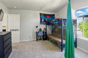 Carpeted bedroom with baseboards