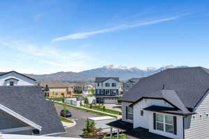 View of mountain background featuring nearby suburban area
