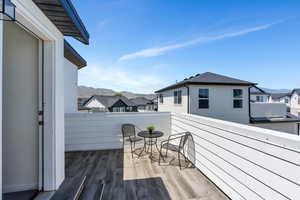 Deck with a mountain view and a residential view
