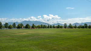 View of mountain backdrop with rural landscape