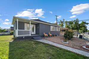 View of front of house featuring brick siding and a porch