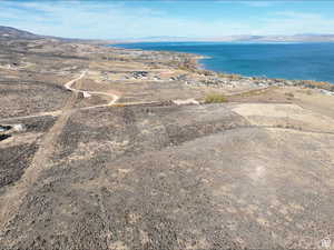 View of property location with a water and mountain view