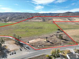 View of rural area with property parcel outlined and mountains