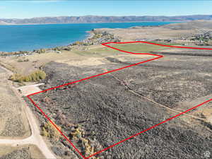 View of property location featuring property parcel outlined and a water and mountain view