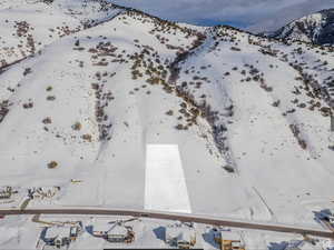 Snowy aerial view featuring a mountain view
