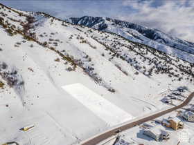 Snowy aerial view with a mountain view