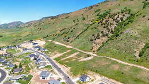 View of property location with mountains and nearby suburban area