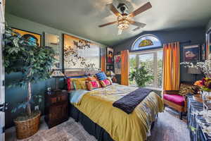 Bedroom featuring vaulted ceiling and ceiling fan
