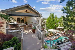 Back of property with a patio and exterior kitchen