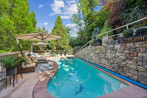 View of swimming pool featuring an outdoor hangout area