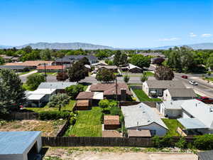 Aerial perspective of suburban area featuring a mountain backdrop