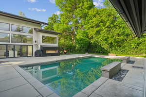 Outdoor pool featuring a patio