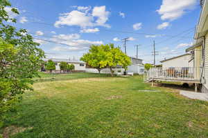 View of yard featuring a wooden deck