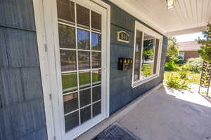 Property entrance with covered porch
