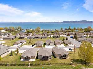 Aerial perspective of suburban area featuring a water and mountain view
