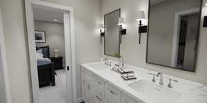 Full bathroom featuring ensuite bath, double vanity, and light carpet