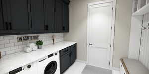 Laundry area with cabinet space, light tile patterned floors, and separate washer and dryer