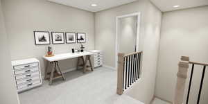 Office with light colored carpet and recessed lighting
