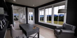Office area with light wood-type flooring, a mountain view, and recessed lighting