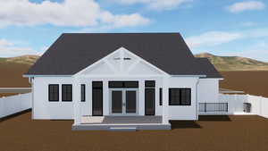 View of front of house featuring a mountain view and a shingled roof