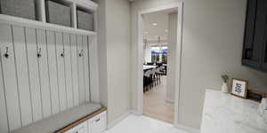 Mudroom featuring recessed lighting and light tile patterned floors