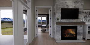 Hall featuring light wood-type flooring, recessed lighting, and a mountain view