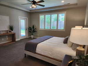 Carpeted bedroom featuring a tray ceiling, access to exterior, baseboards, recessed lighting, and a ceiling fan