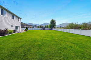 View of yard featuring a mountain view, a playground, and central air condition unit