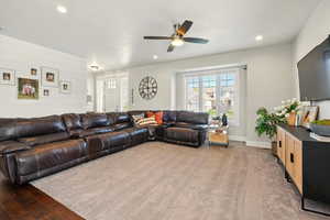 Living area featuring ceiling fan, recessed lighting, and baseboards