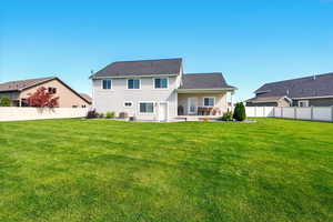 Back of property featuring a patio, cooling unit, and a shingled roof