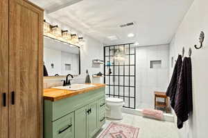 Recently Updated 3/4 Bath, Custom Tile, Glass Shower Door, Vanity, Lighting, Mirror, Flooring