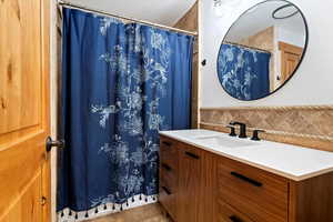 Updated Full Bath, New Mirror, Vanity, Lighting, Tile Backsplash and Flooring
