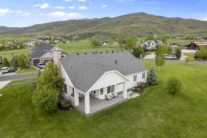 Aerial perspective of suburban area with a mountainous background