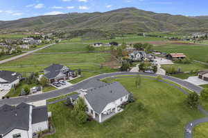 Aerial perspective of suburban area with a mountainous background