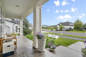 Covered porch with a residential view