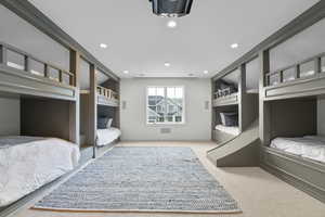 Carpeted bedroom featuring recessed lighting and baseboards
