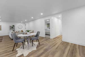 Dining space with recessed lighting, light wood-type flooring, and baseboards