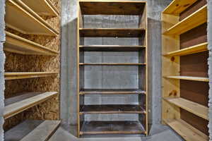 Stairway with unfinished concrete flooring