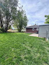 View of yard with a patio area